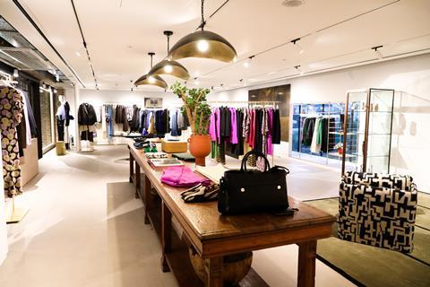 Interior of Jigsaw store, Battersea Power Station, showing womenswear displays
